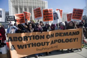 protesters with abortion on demand signs